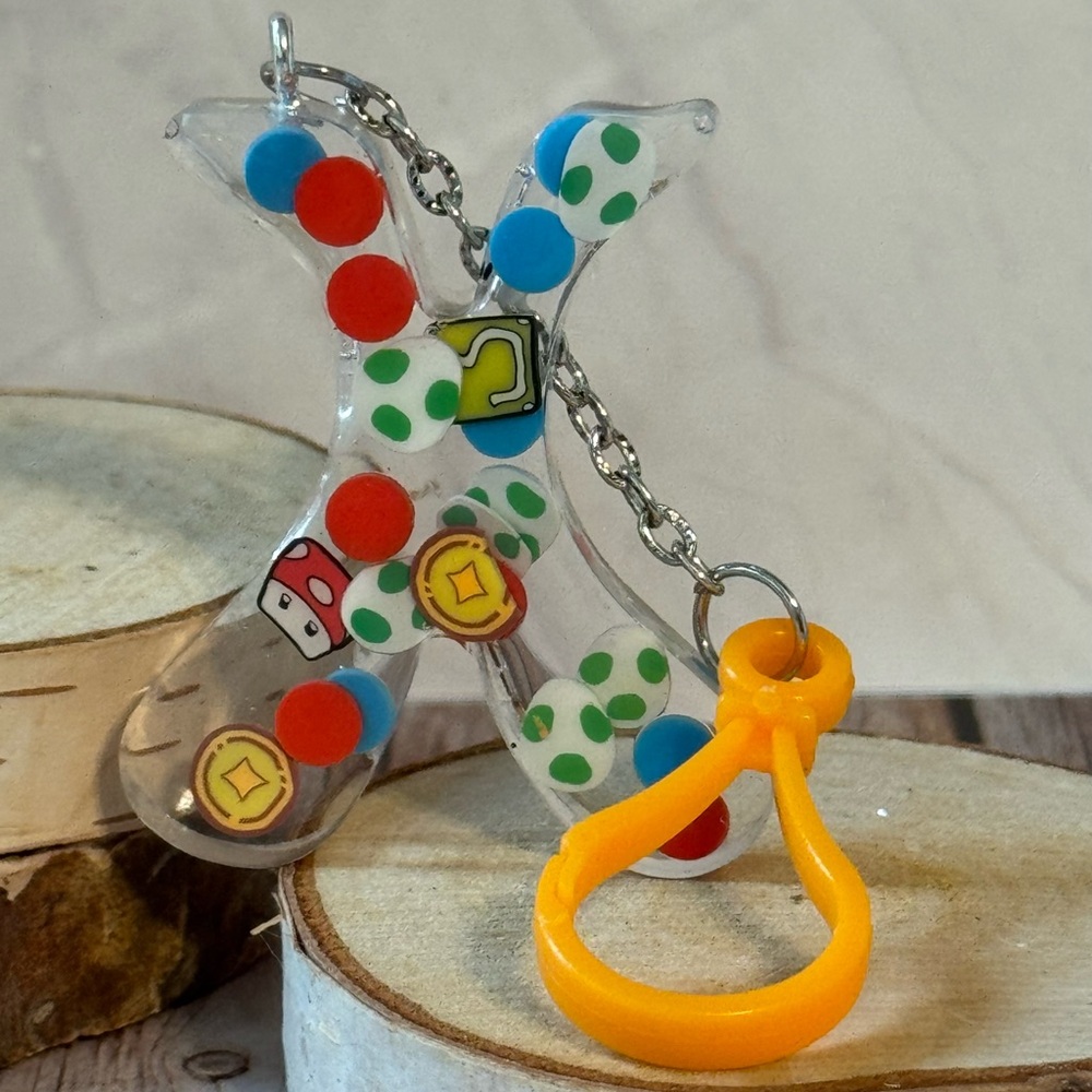 Letter X with video game inspired charms newly made.